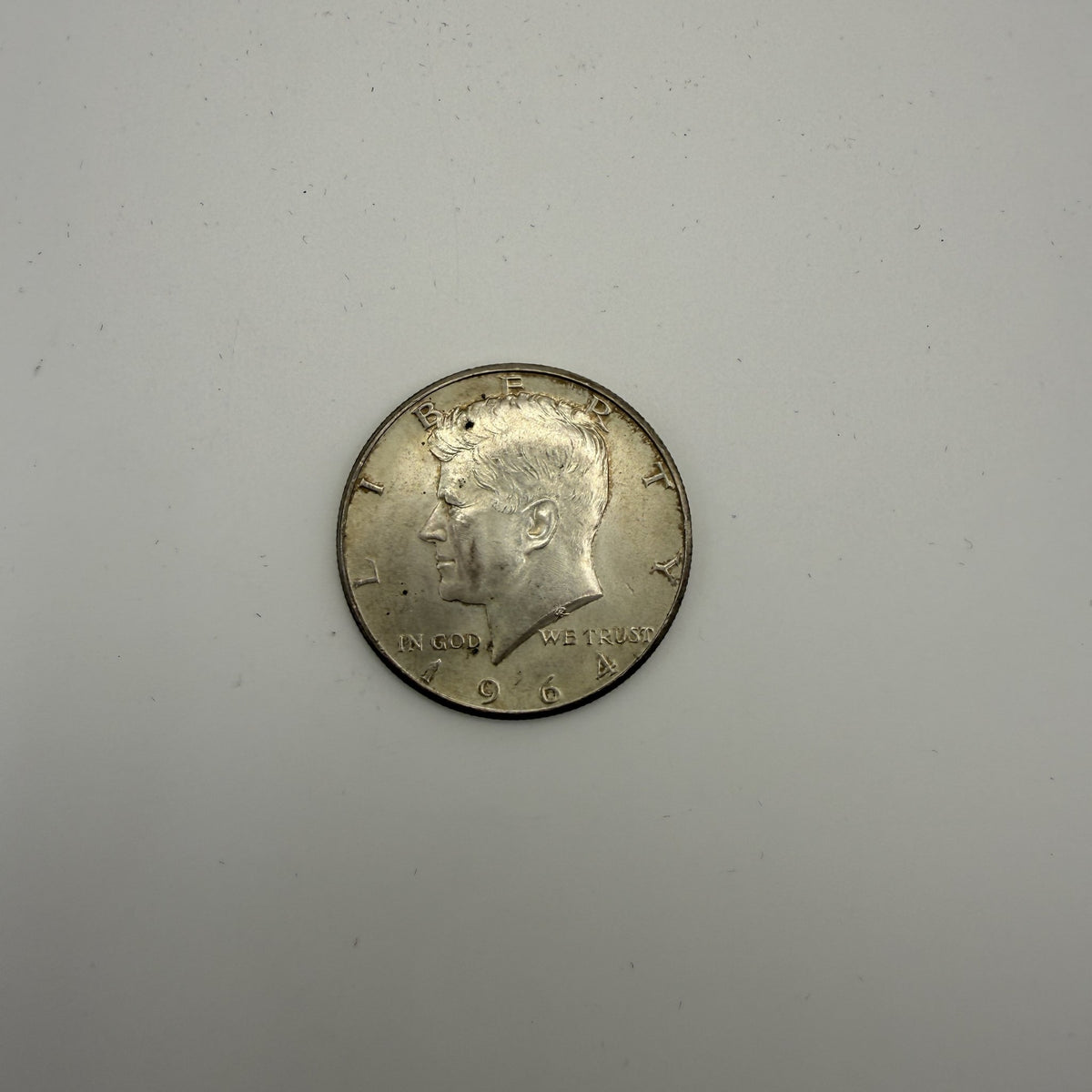 1964 Kennedy half dollar - front (representative)