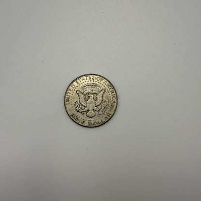 1964 Kennedy half dollar - back (representative)