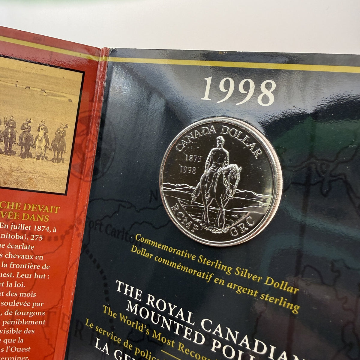 1998 Canada $1 RCMP 125th Anniversary Sterling Silver Dollar & Collector Pin Set - front
