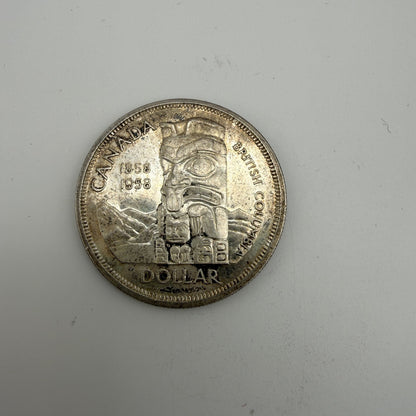 1958 Canada $1 British Columbia Centennial Totem Pole 80% Silver Dollar - front